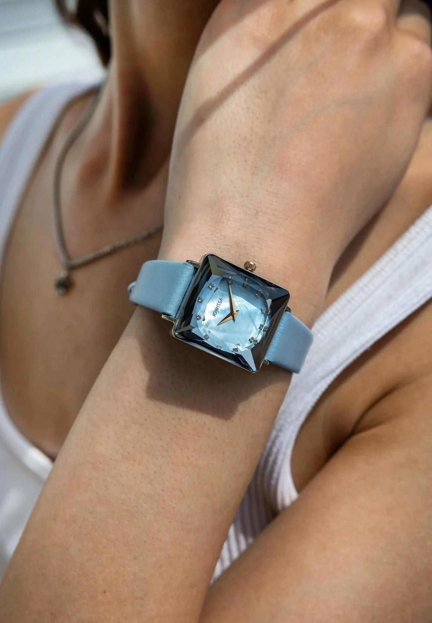 Like an ocean breeze this light blue mother of pearl dial with 12 cubic zirconia stones looks stunning. Stainless steel case and a light blue leather strap - all Swiss Made.