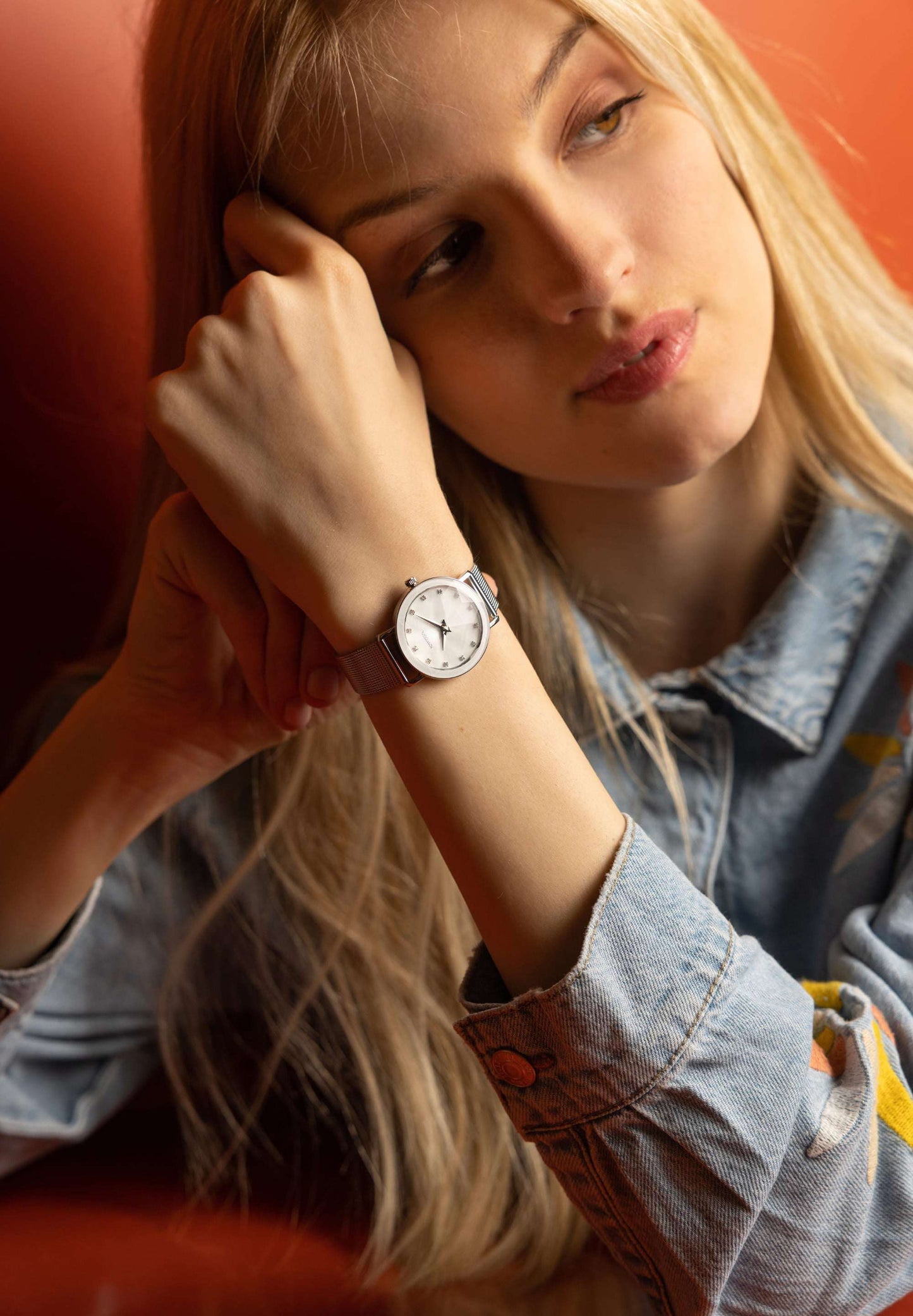 Facet swiss watch for women with grey strap and white dial - all swiss made watch wor by a girl with jeans jacket