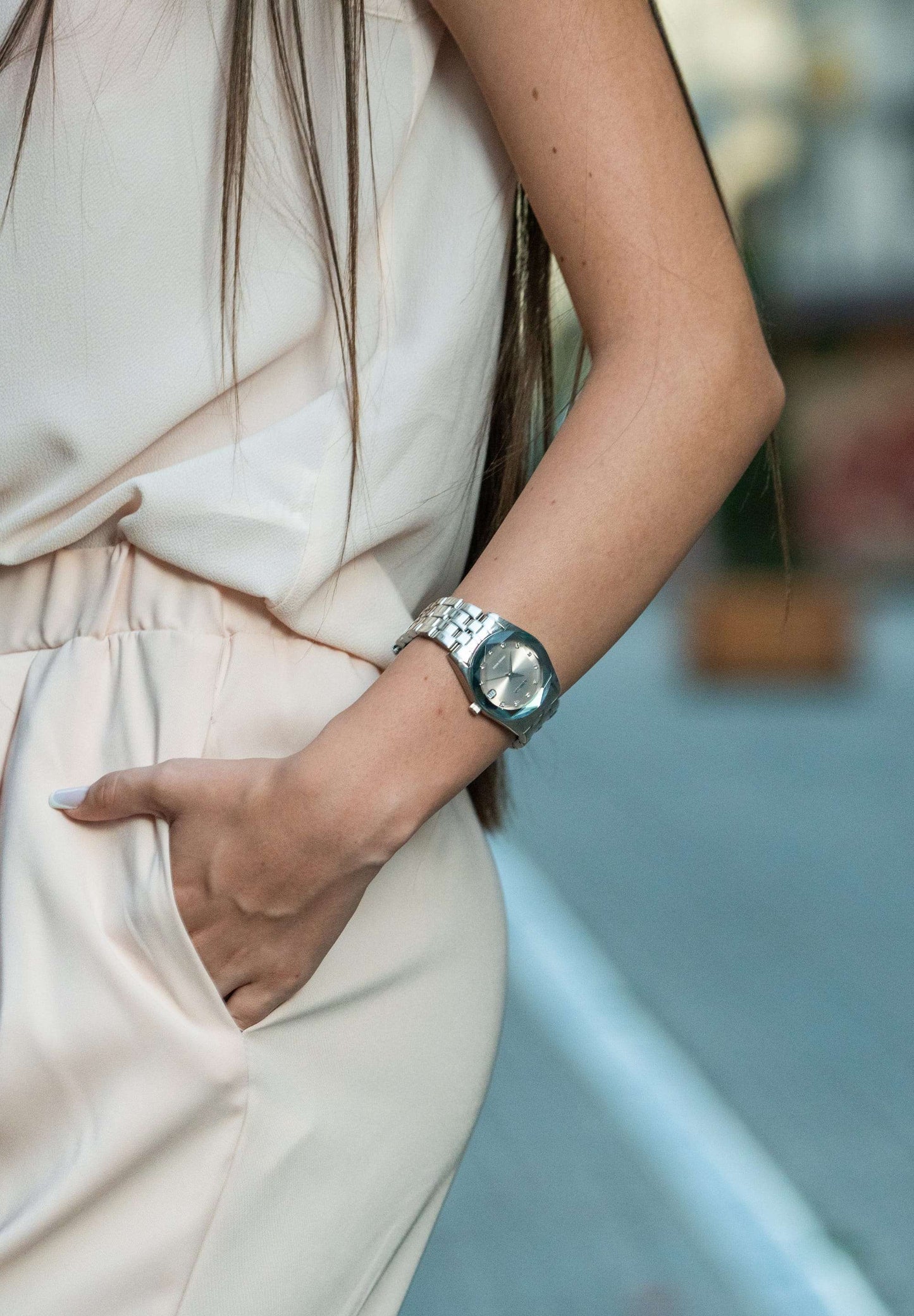 A silver dial swiss ladies watch with a stainless steel strap for every day
