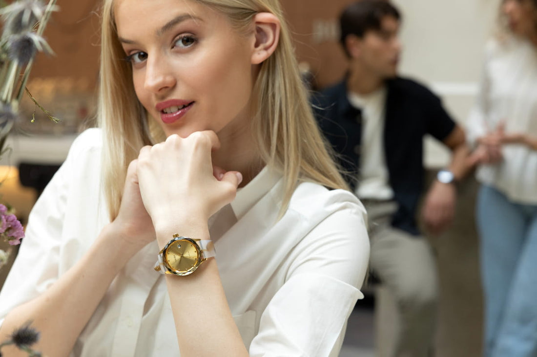 A Jowissa womens watch on a ladie's wrist. This Tiro timepiece in gold has a facetted glass and a sleek silicone strap, all Swiss Made.