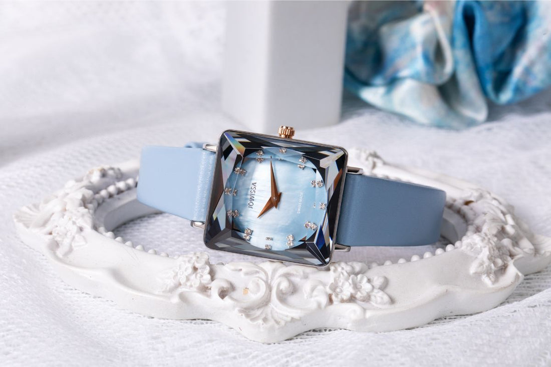 Blue woman's dial watch with faceted glass, square case in rose gold and silver. The baby blue leather strap fits nicely on your wrist.