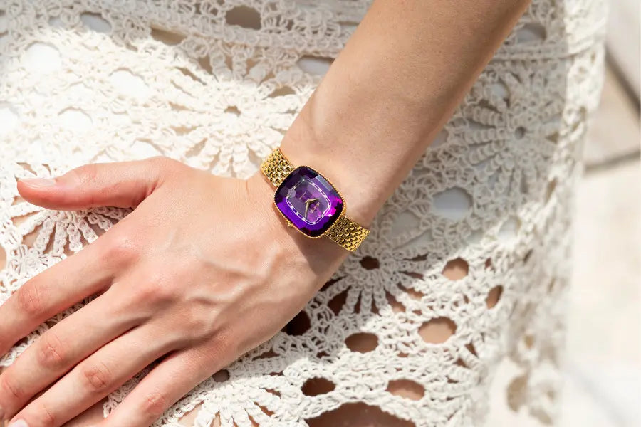 Jowissa purple-dial women's Swiss Made watch with a gold bracelet and faceted glass
