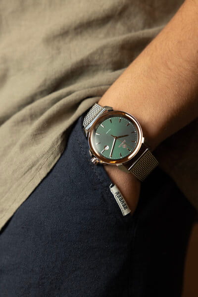 Man wearing a green-dial Jowissa Swiss Made watch illustrating Swiss watch quality and craftsmanship