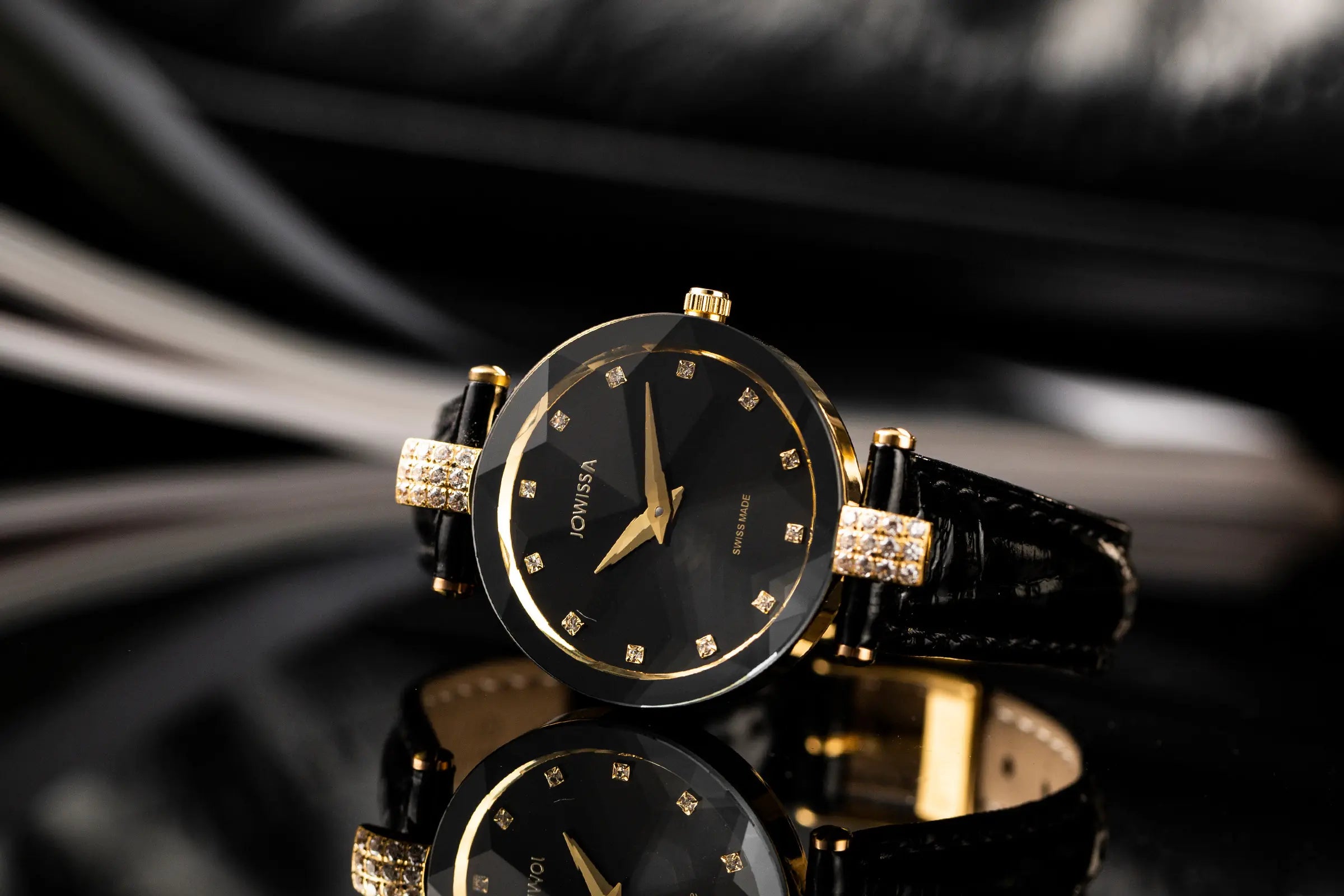 Jowissa Facet Strass Women's Dress Watch: Black Sunray Dial with Diamond-Cut Glass and Black Leather Band.