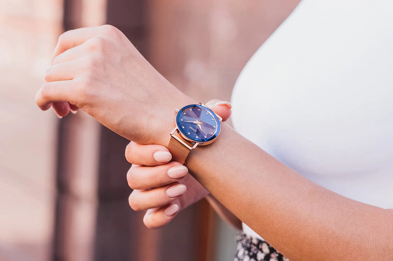 Jowissa Facet 36mm Women's Watch: Blue Sunray Dial with Rose Gold Mesh Band and Diamond-Cut Crystal.