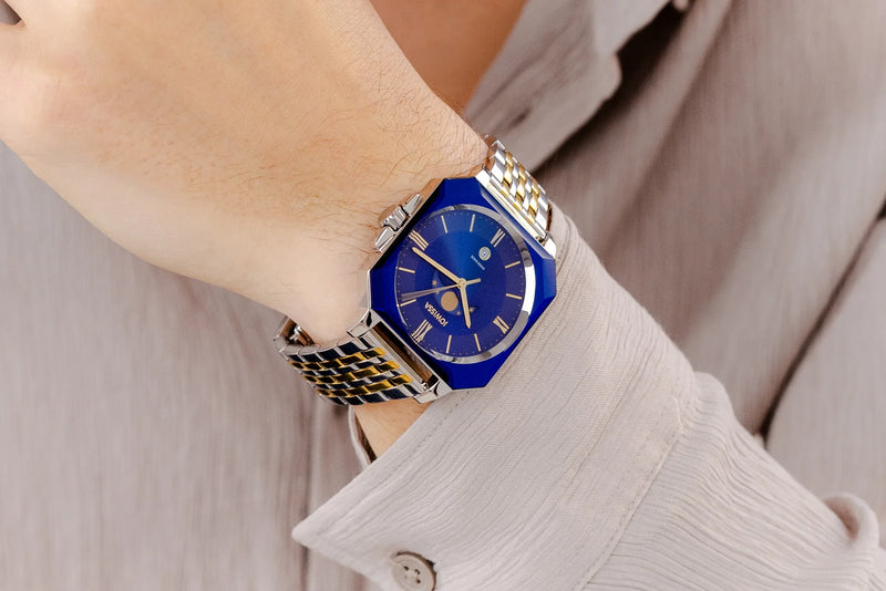 Octa Moon gents watch with a octagonal case and a bicolor bracelet in gold and silver. 