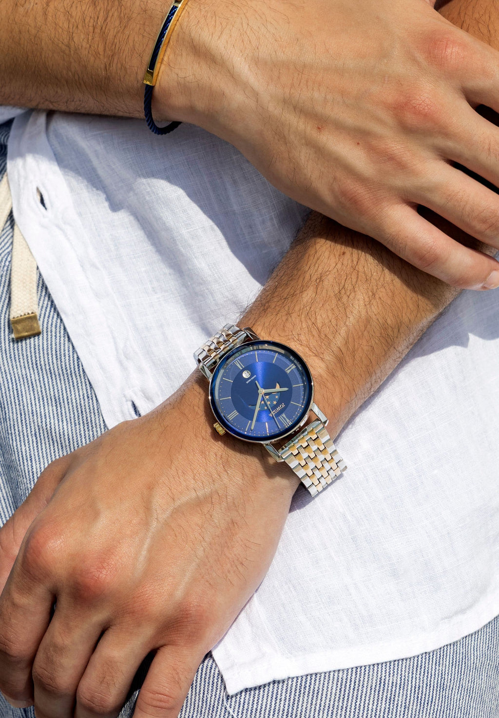Swiss silver and blue watch for men - with gold and silver strap and blue dial with moon details in the front - all swiss made watch