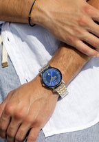 Swiss silver and blue watch for men - with gold and silver strap and blue dial with moon details in the front - all swiss made watch