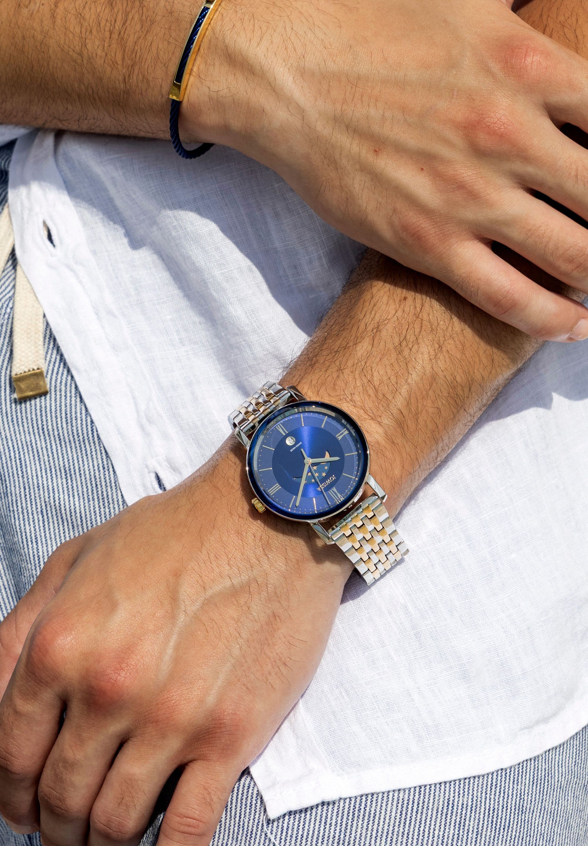 Swiss silver and blue watch for men - with gold and silver strap and blue dial with moon details in the front - all swiss made watch
