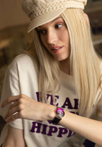 Purple swiss watch for girls with purple strap and purple dial - all swiss made worn by a girl with purple text on shirt