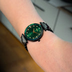Swiss green safira watch - with green strap and green dial with gold details in the front - all swiss made watch for women