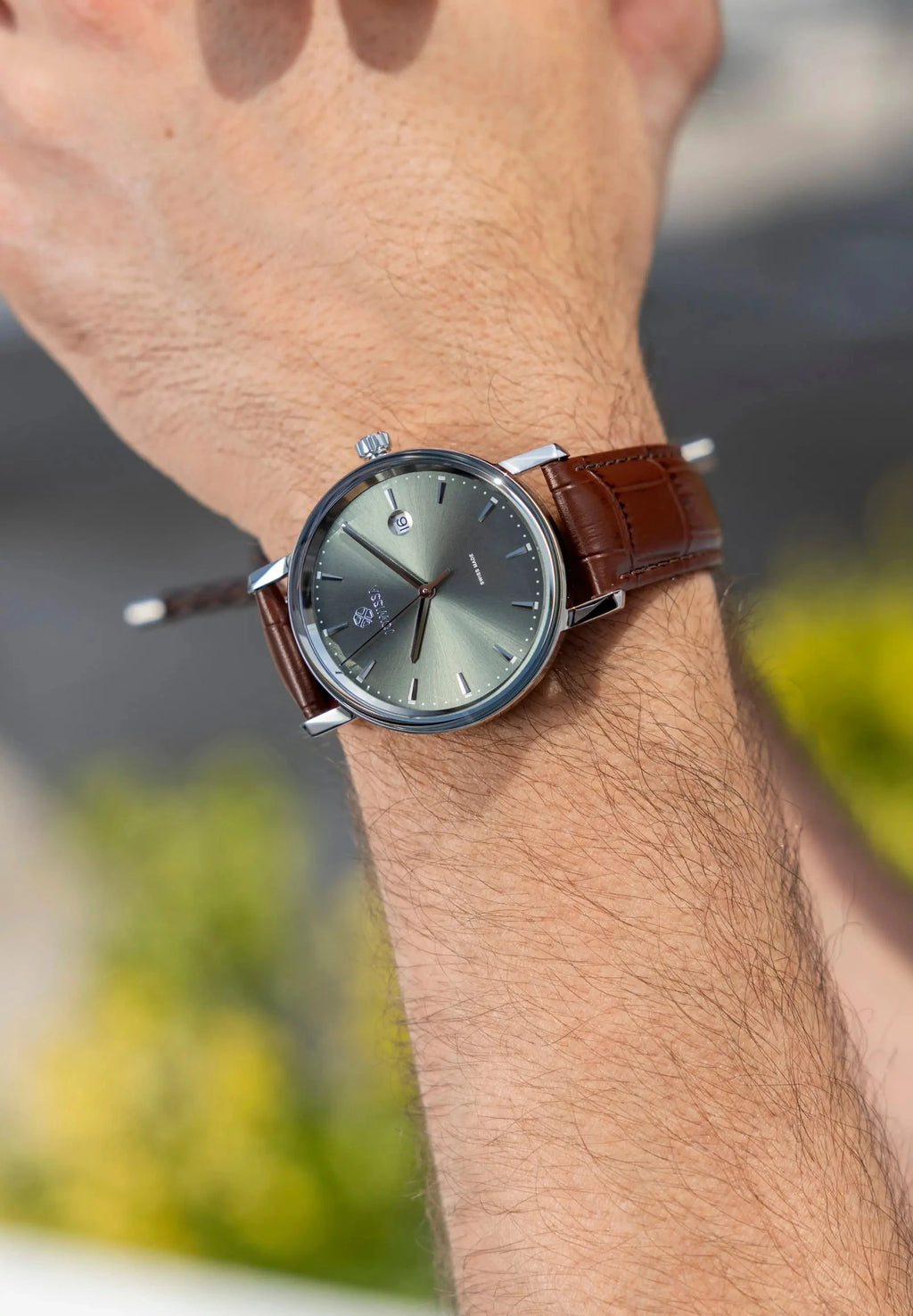 Gents watch, 40mm case with a pale green sunray dial, stainless steel case 40mm and a brown leather strap. All Swiss Made. Magno Jowissa Timepiece.