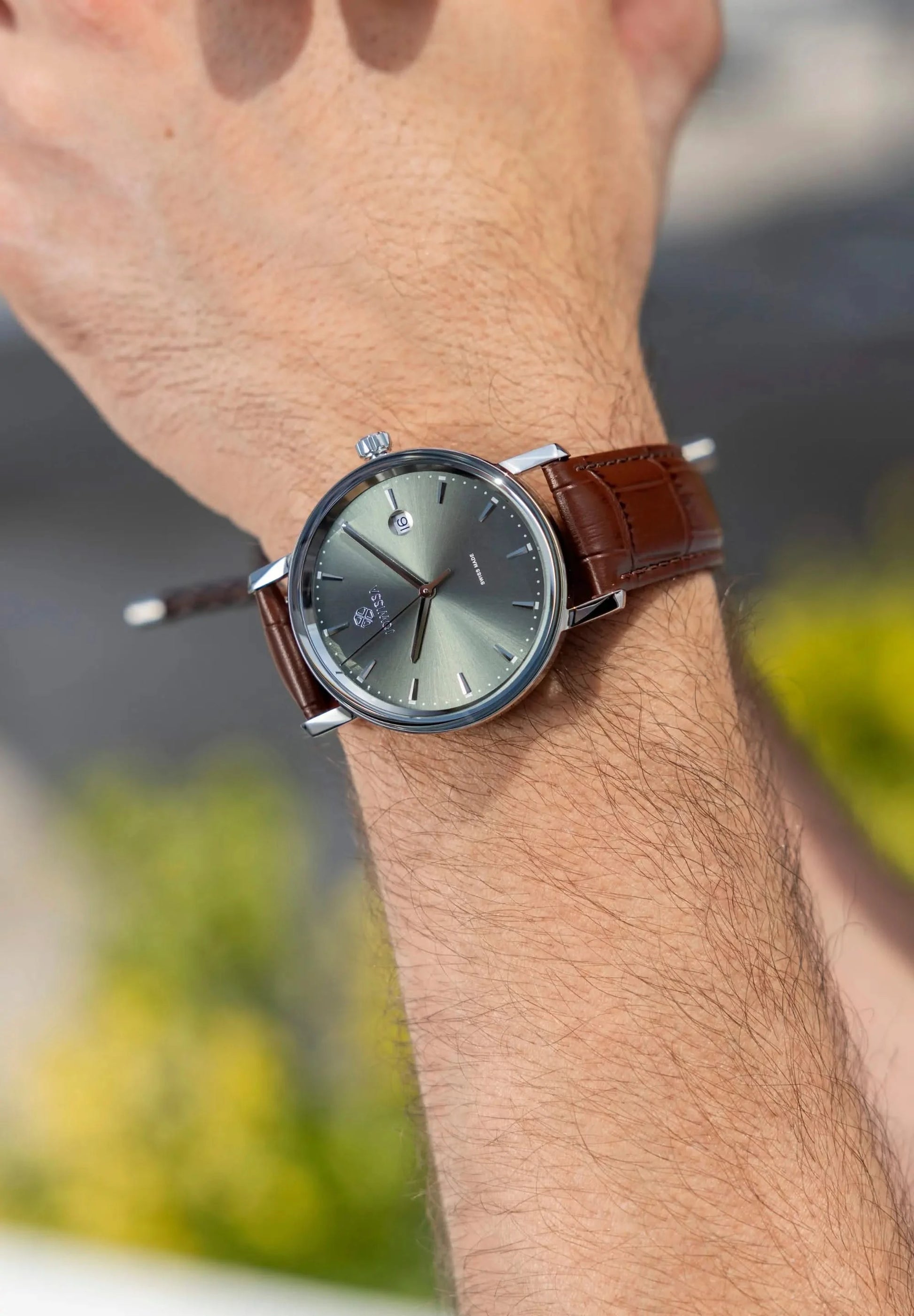 Gents watch, 40mm case with a pale green sunray dial, stainless steel case 40mm and a brown leather strap. All Swiss Made. Magno Jowissa Timepiece.