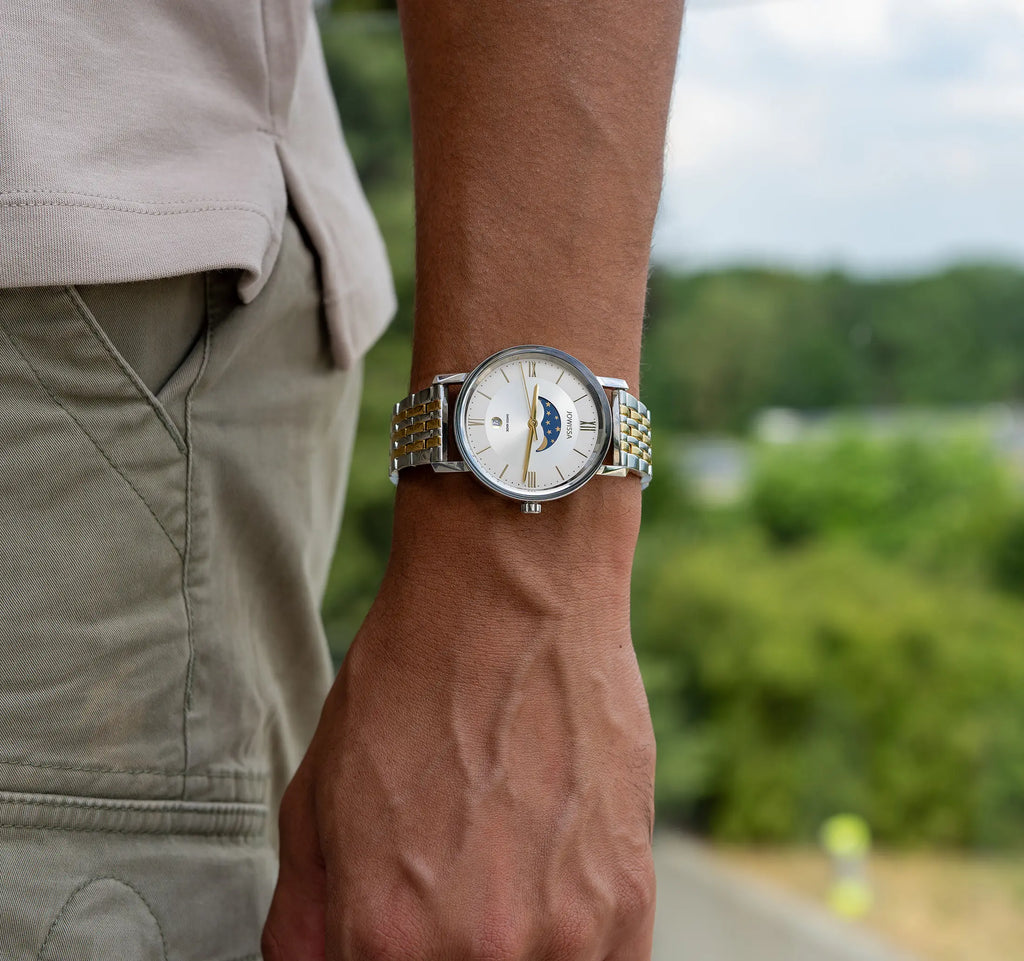 Swiss white watch for men - with silver and gold strap and white dial - with details of the moon and stars