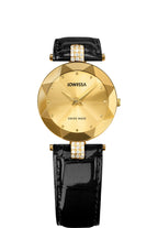 A Jowissa women's watch featuring a faceted gold-tone round dial, gold-tone hands and markers, a glossy black alligator-textured leather strap, and two decor elements with strass stones.