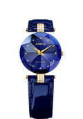 A luxury women's watch by Jowissa featuring a faceted blue crystal watch face, gold-tone hands and markers, and a glossy dark blue strap with gold-tone hardware and crystal accents.