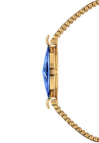 Close-up side view of a Jowissa Facet Strass timepiece in a gold-tone with a faceted blue crystal and two decor elements.