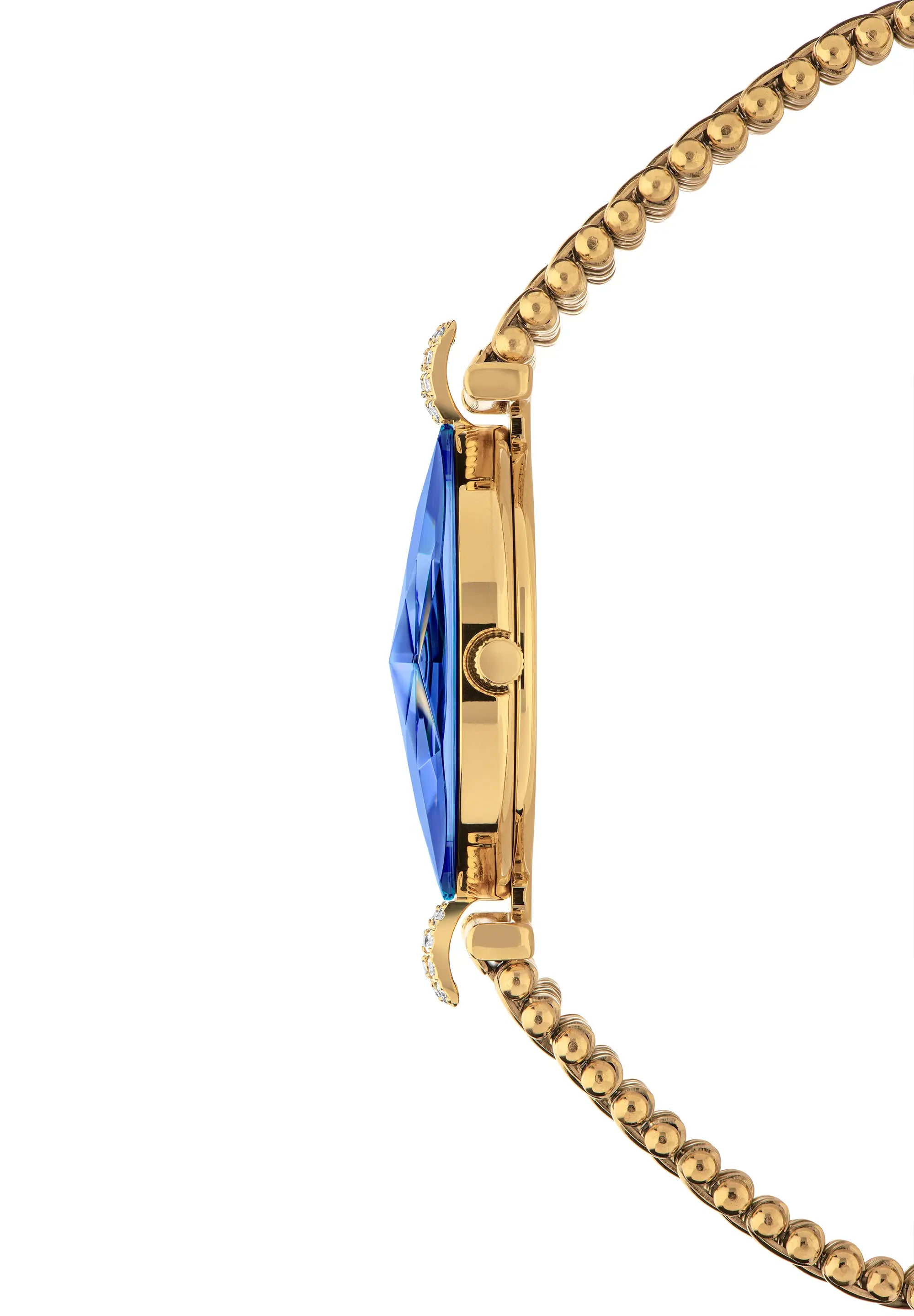 Close-up side view of a Jowissa Facet Strass timepiece in a gold-tone with a faceted blue crystal and two decor elements.