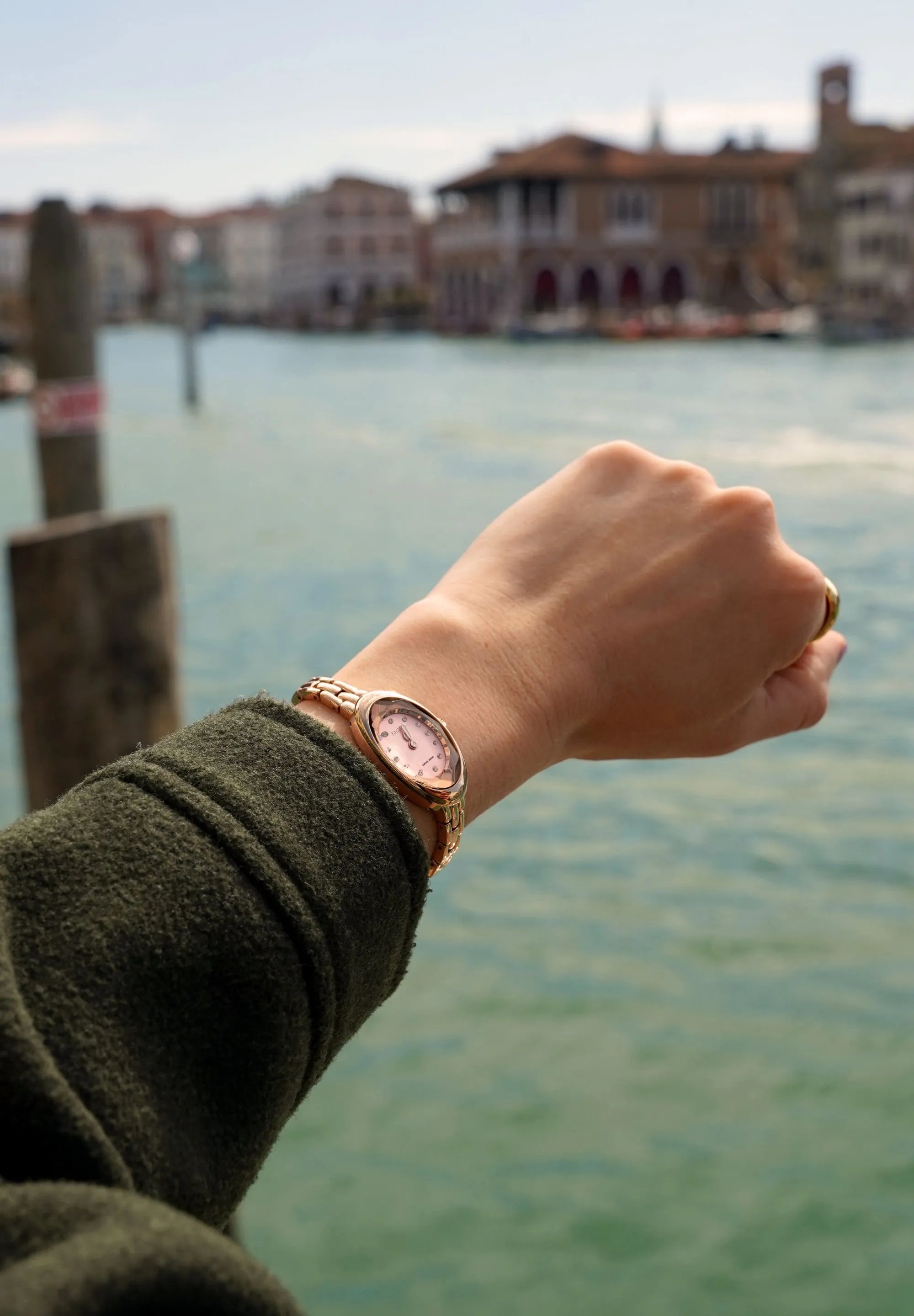 Petite jewelry watch for a small ladies wrist. Rose gold with a facetted glas that covers the oval case shape. All Swiss Made.