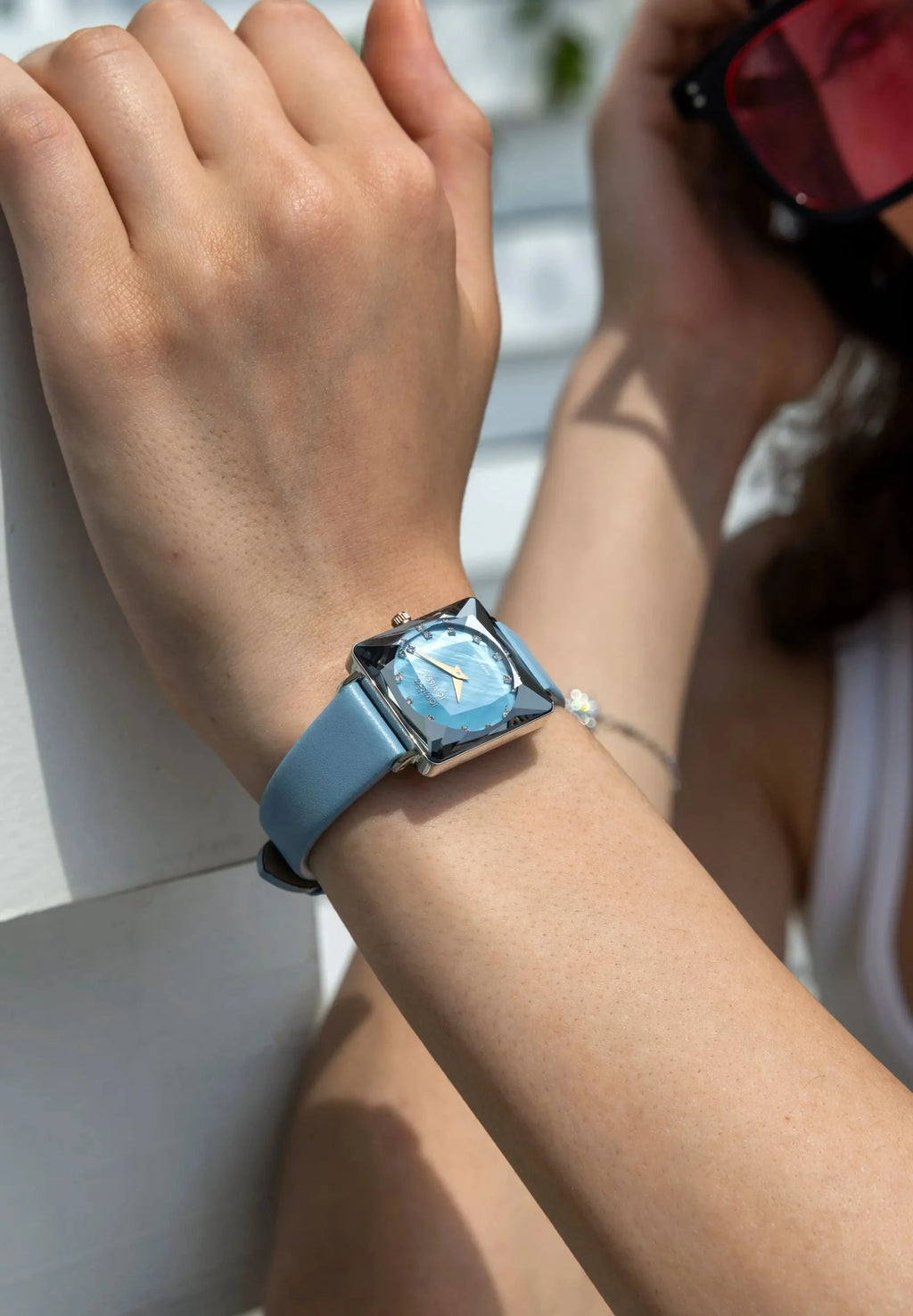 light blue Facet Princess Watch, square with facetted glas and a blue leather strap, all Swiss Made. Brand Jowissa.