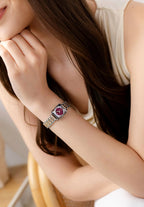 Unique petite ladies watch with a bicolor bracelet in silver and rose gold and a burgundy red dial. Stainless steel and all Swiss Made.