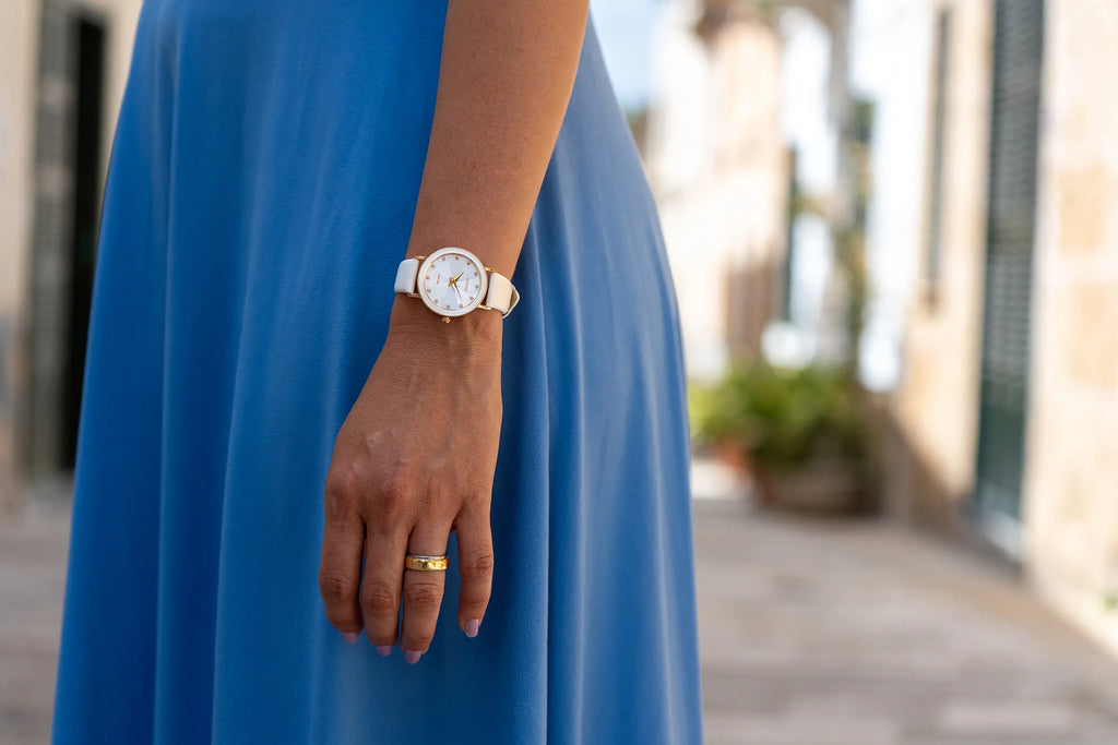 Swiss white watch for women - with white leather strap and white dial with gold details in the front - all swiss made watch for ladies