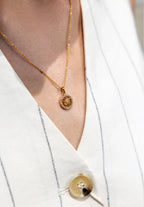 Jowissa Jewelry Necklace made of stainless steel in gold with a pendant showing a Swiss flower, the Edelweiss, in a circle of 20 cubic zirconia.