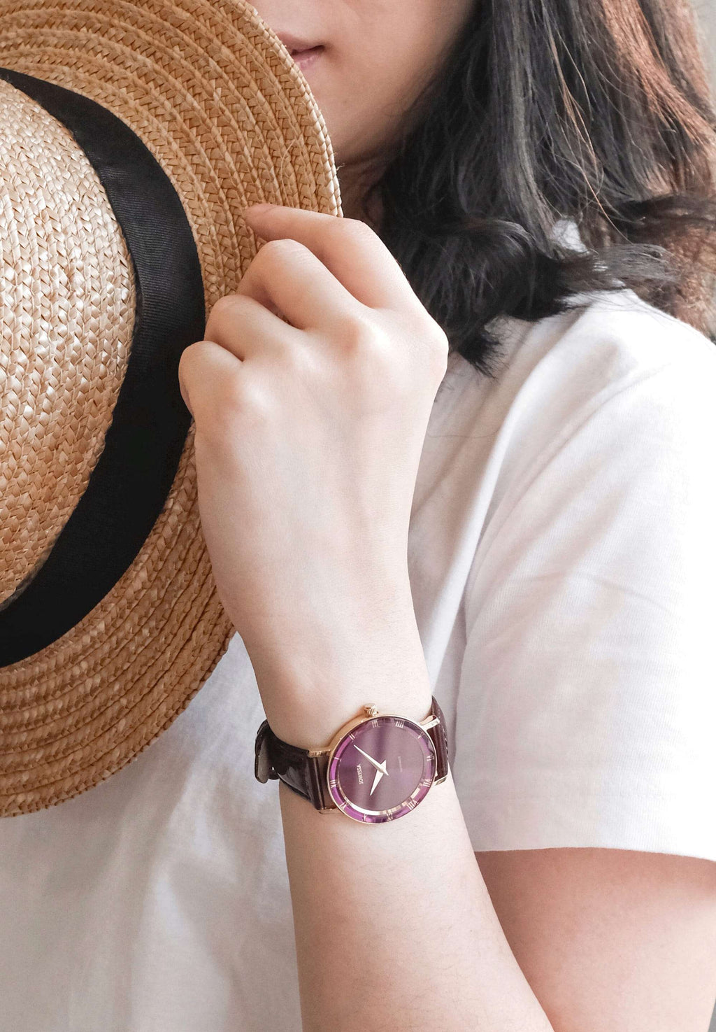 J2.293.M ladies watch - purple swiss watch made for women - all made in switzerland- girl wearing a purple watch with a hat on the hand