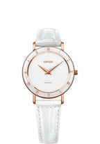 Womens swiss watch designed for all seasons. With precision craftsmanship, it features a minimalist white dial paired with refined rose-gold hour hands and Roman numerals elegantly placed on the polished bezel.