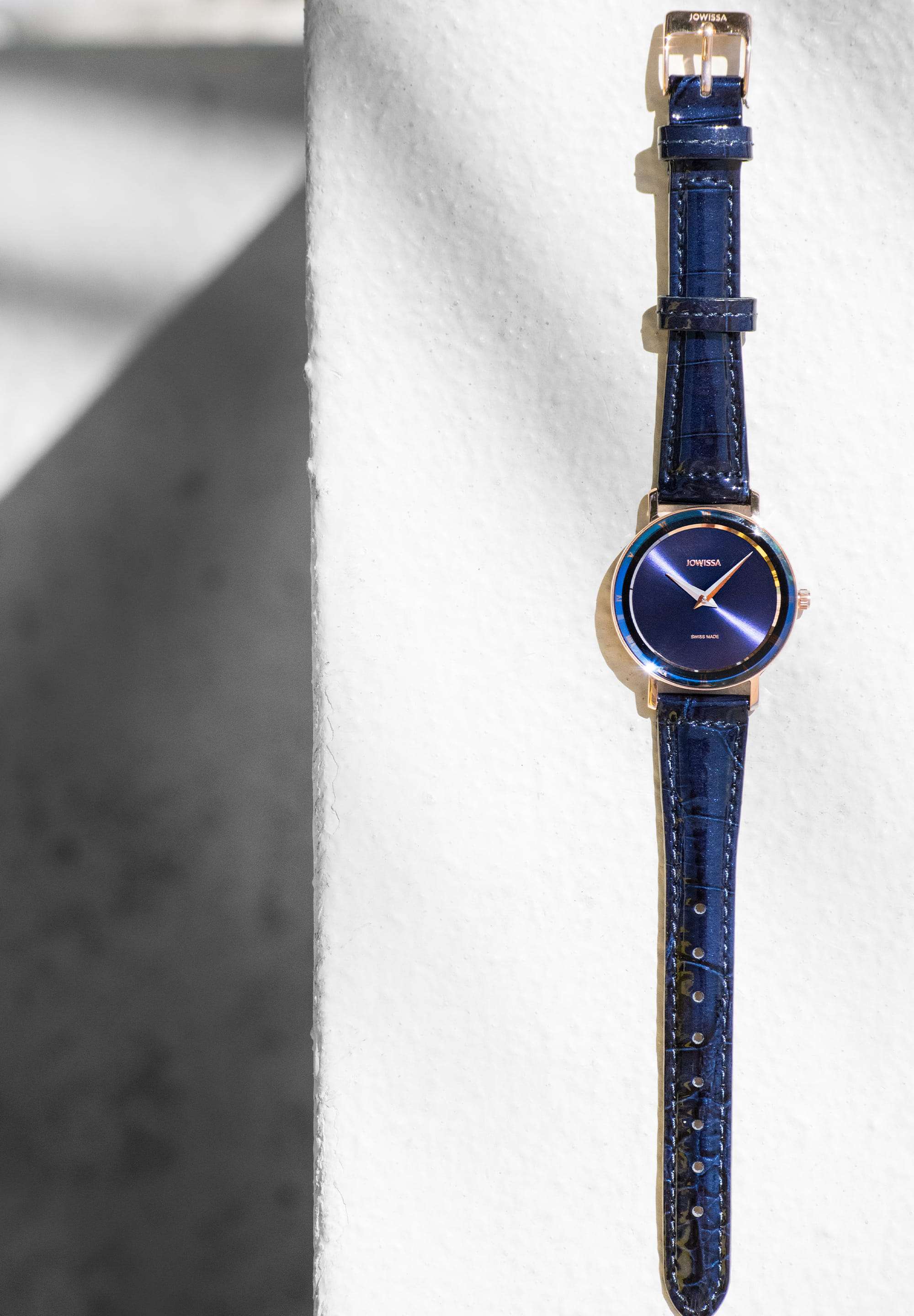 Swiss-made navy blue watch for women brings sophisticated style and a timeless color to your wrist. It features an elegant blue dial with golden accents on the hour hands and Roman numerals, adding a classic yet modern touch. The 30mm stainless steel case offers a delicate, refined profile, perfect for any occasion.