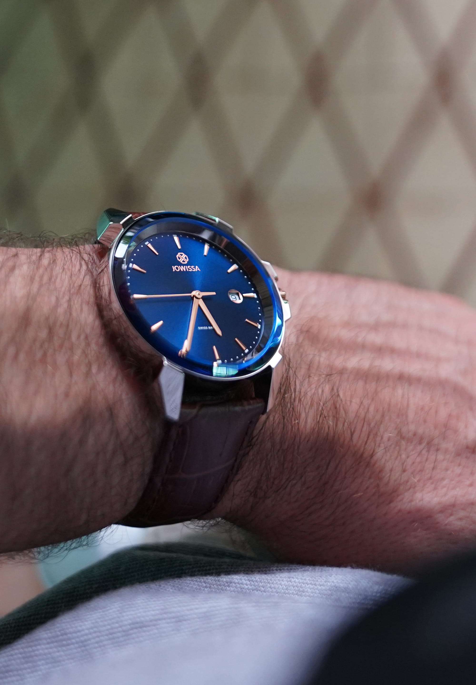 Blue swiss watch for men - with brown leather strap and blue dial with gold details in the front - all swiss made