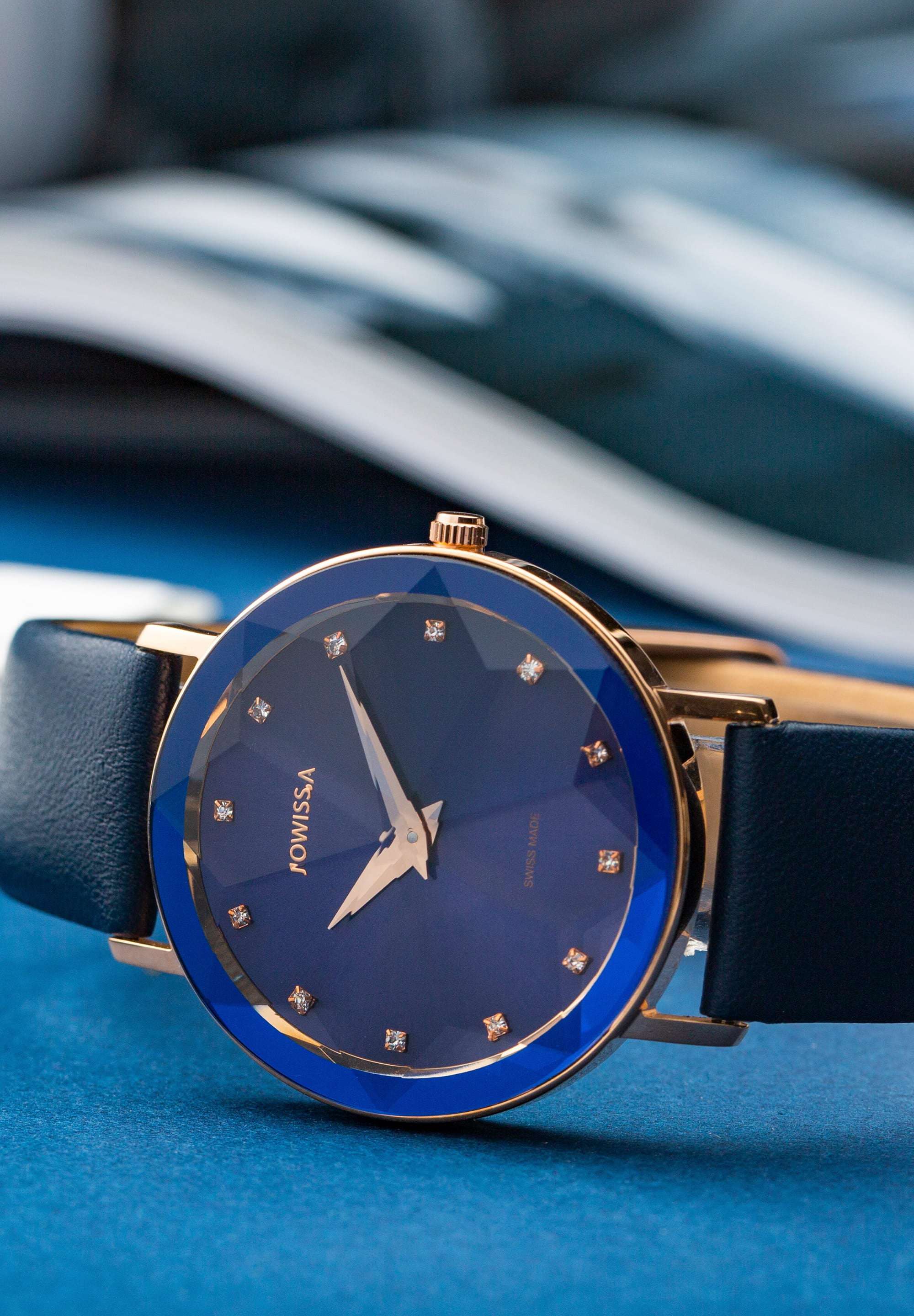 Blue swiss watch for ladies - with blue strap and blue dial with gold details in the front - all swiss made for women