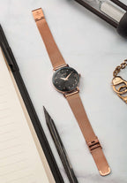 Swiss facet watch for ladies with gold strap and black dial - all swiss made