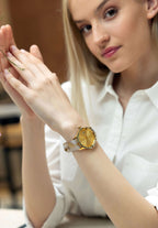 J6.243.M  swiss watch – womens watch with a gold-plated stainless steel case and a striking black dial -detailed with 12 rhinestones serving as hour markers, adding a touch of sparkle. Powered by a precise Ronda Swiss quartz movement - includes a date window for added convenience.