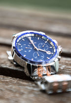 Silver Swiss men watch with silver strap and blue dial - the watch has gold details too - all swiss made