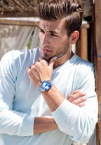 Swiss mens watch with silver strap and blue dial - a strong man wearing a silver watch - all swiss made