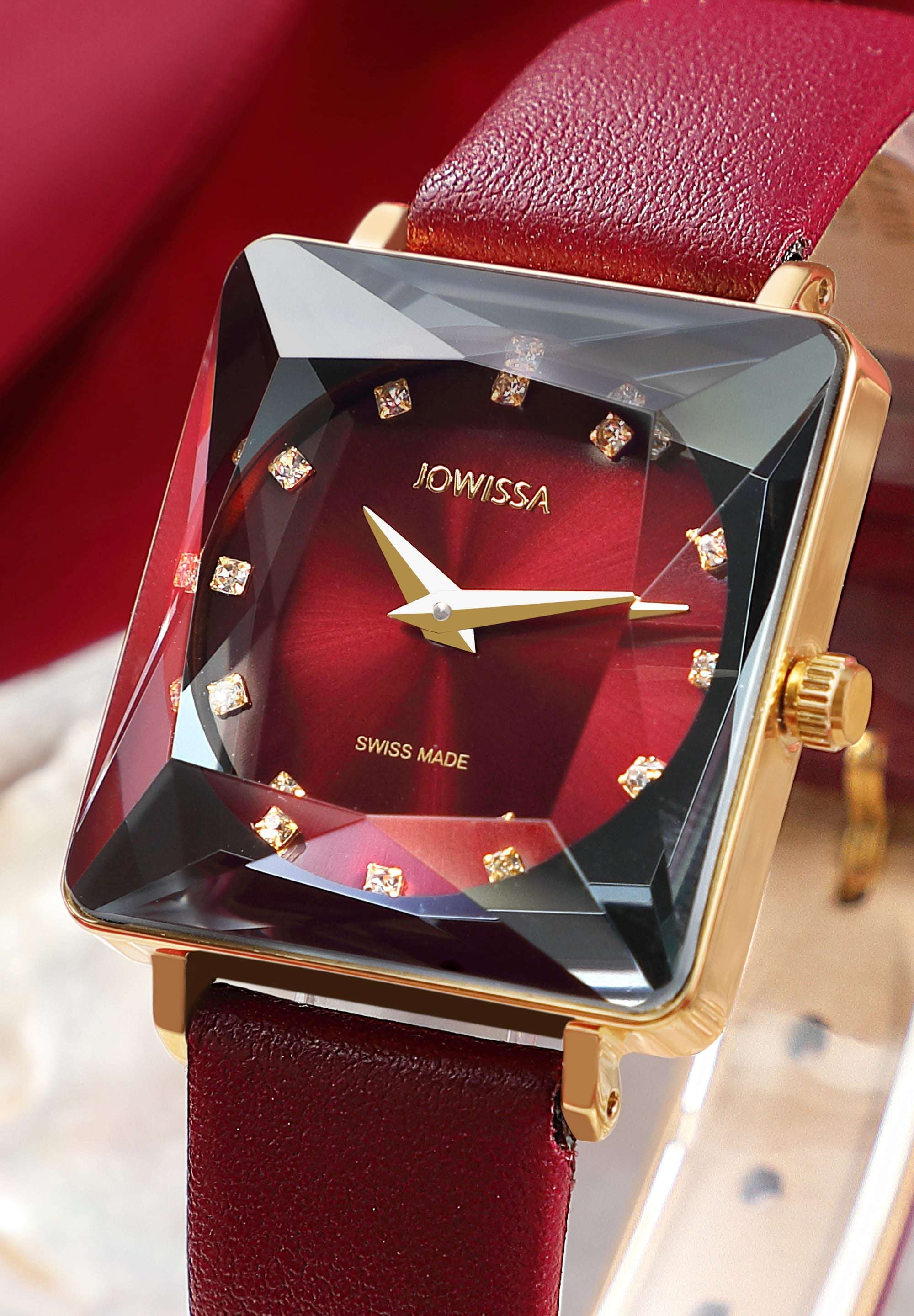 Red swiss watch for women - with red leather strap and red dial with gold details in the front - all swiss made
