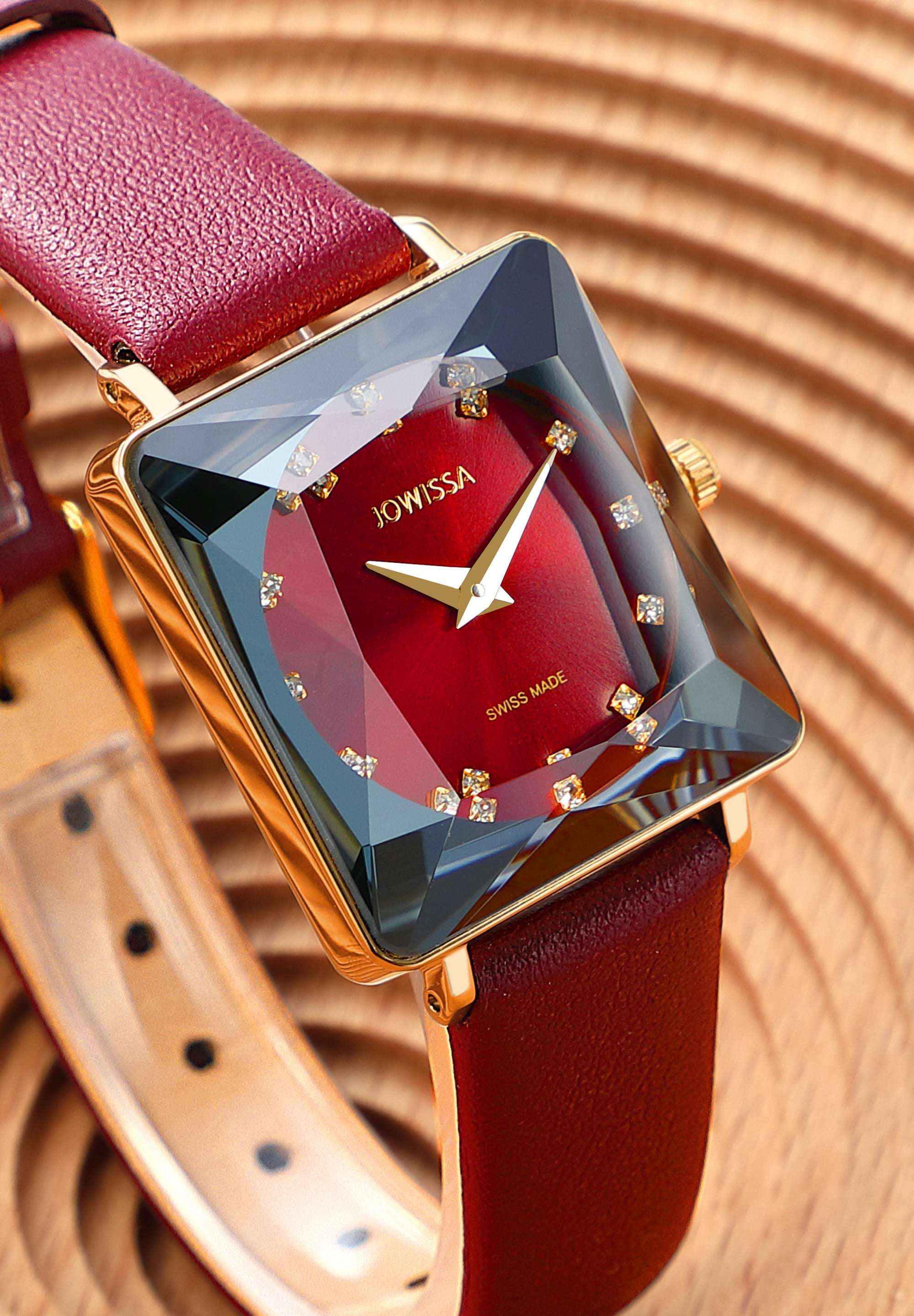 Red swiss watch - with red leather strap and red dial with gold details in the front - all swiss made