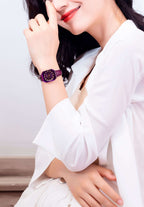 Purple swiss watch for women - with purple strap and dial and gold details in the front - all swiss made watch for ladies