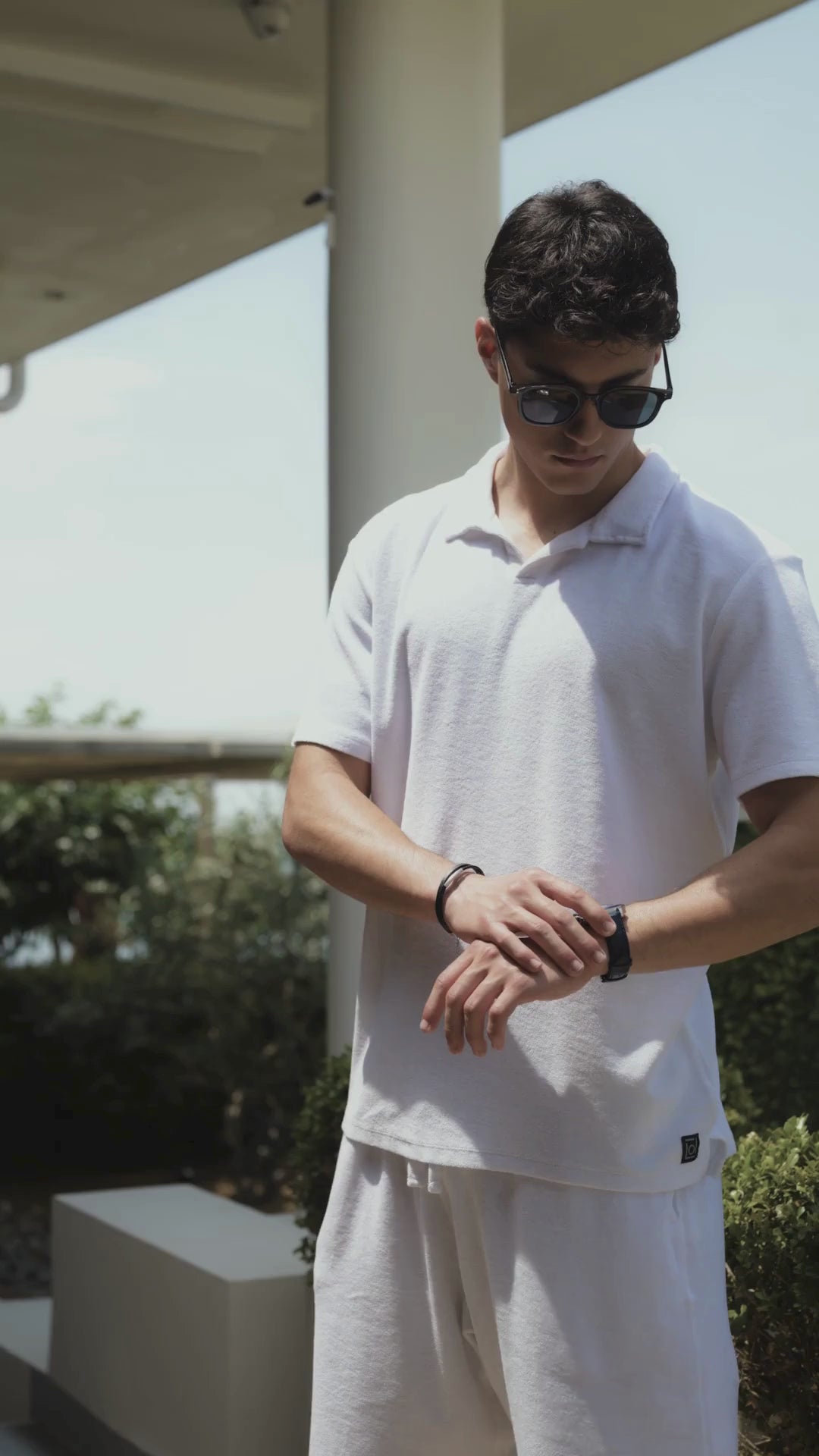 Swiss blue mens watch - all swiss made with blue leather strap and blue dial - worn by a man with white shirt