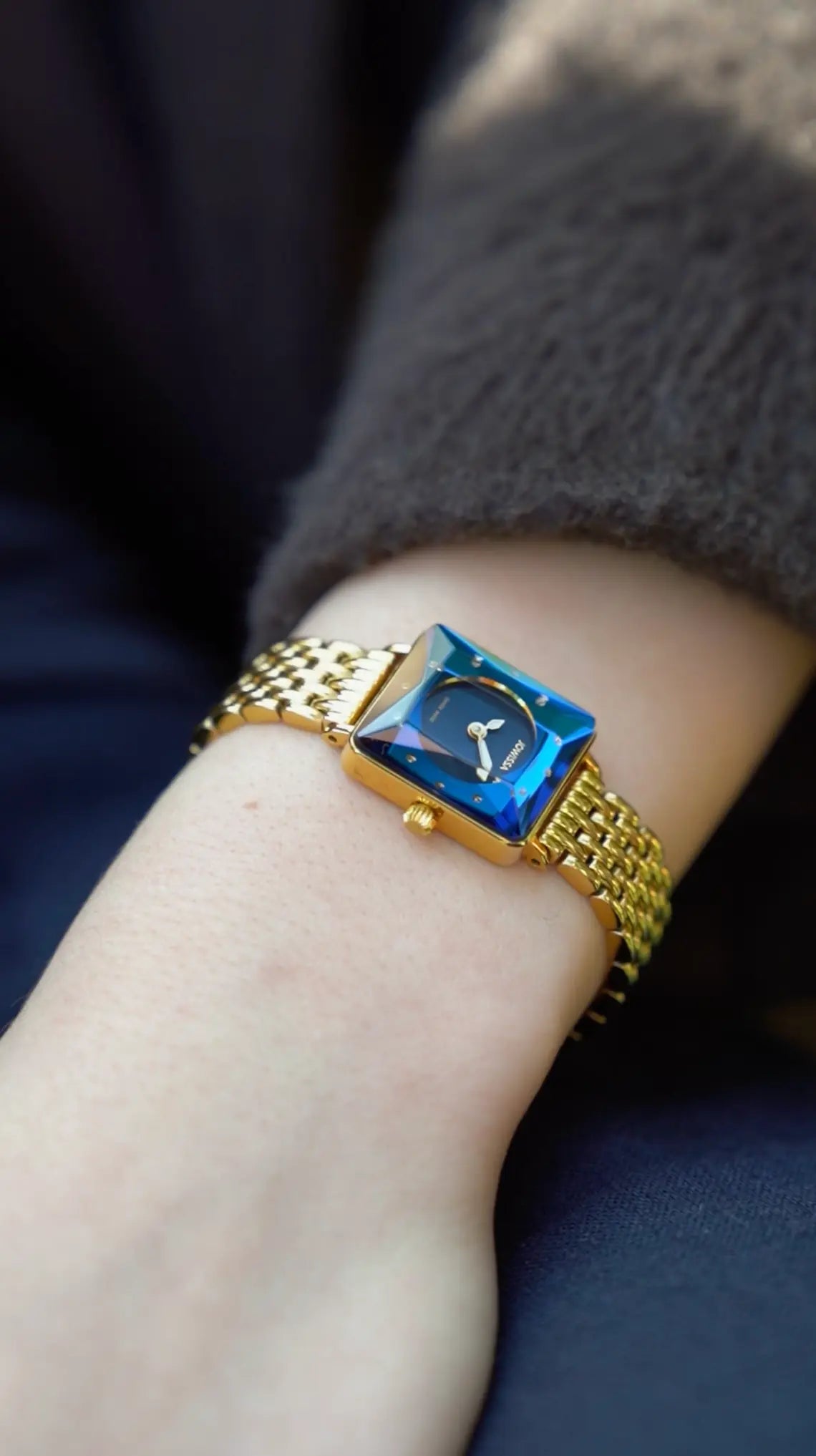 Facet Princess Petite Small Womens Dress Watch by Jowissa. All Swiss Made with Blue Princess Cut Diamond inspired Glass and Blue sunray Dial Gold Bracelet.