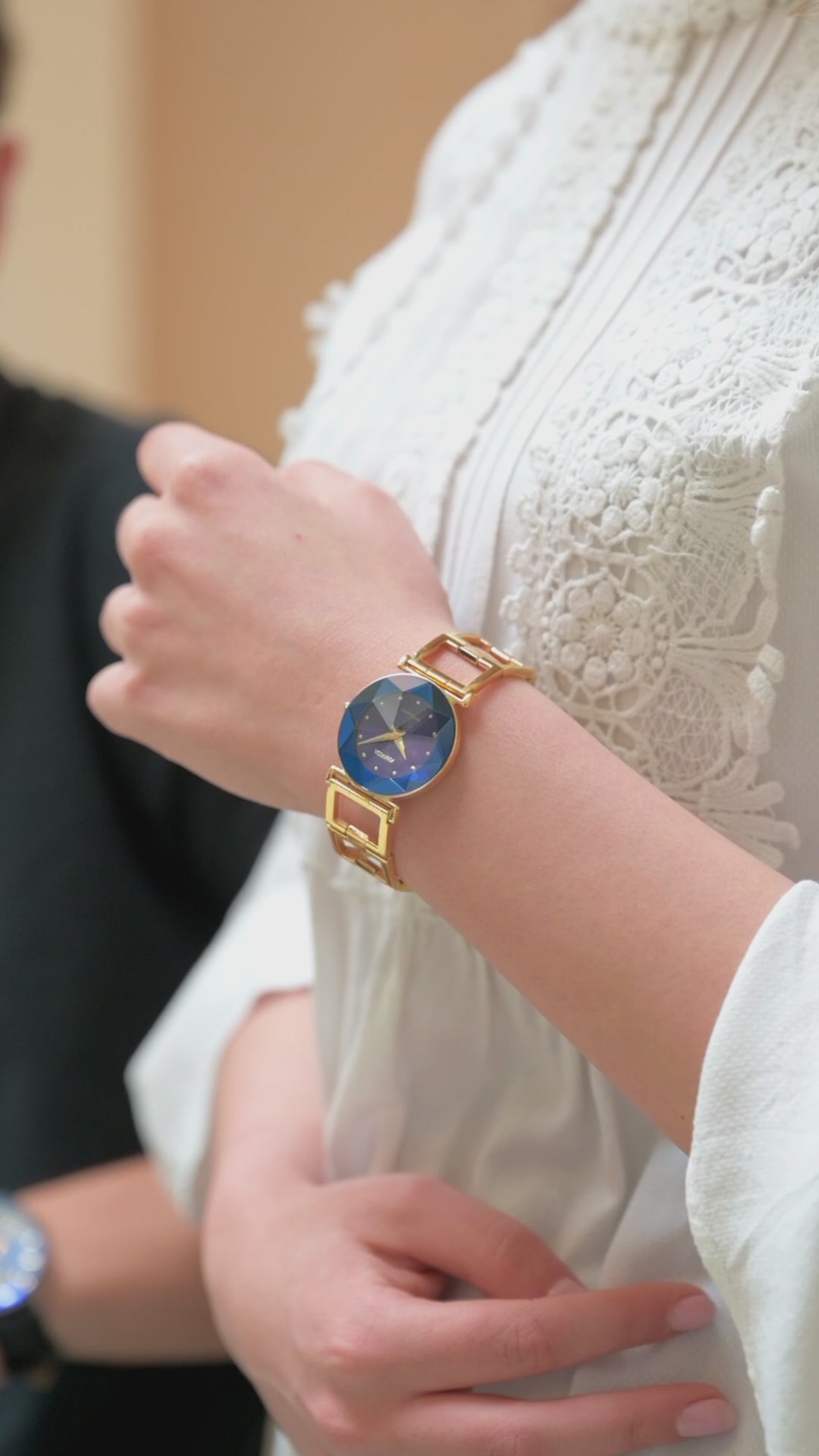 Swiss blue watch for women with gold strap and blue dial with gold details in the front - all swiss made watch for women