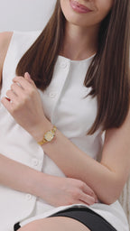 Facet Radiant gold watch for women - with gold strap and gold dial - worn by a girl with white shirt - all swiss made watch 